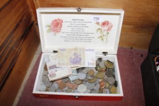 A box of various coinage and bank notes