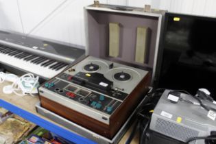 A Tandberg reel to reel tape recorder in carrying