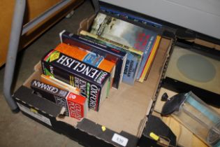 A box of various dictionaries and other books