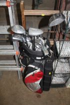 A BagBay golfing bag and contents of clubs to incl