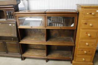 A mahogany globe Wernicke type sectional bookcase