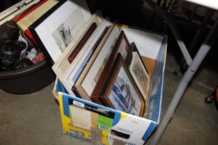 A box of miscellaneous pictures and prints includi