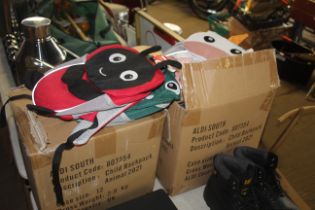 A quantity of various children's back packs in the