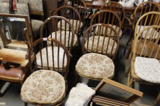 A set of seven Ercol dining chairs