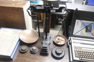 A set of wrought iron scales and various weights