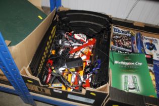 A box of Scalextric items