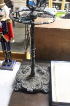 An ornate cast iron stick stand