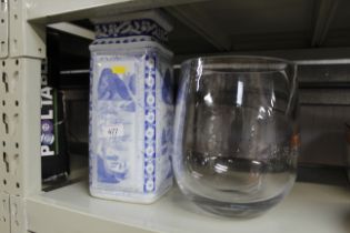 A blue and white vase and a heavy glass vase