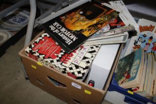 A box of games, puzzles and motor car books