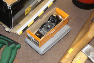 A Stanley 220 smoothing plane together with a scre