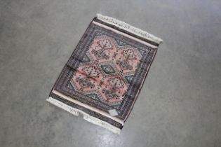 An approx. 2'3" x 1'7" Bokhara rug
