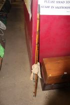 A vintage cane three piece fishing rod