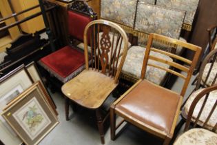 An elm seated stick and wheel back dining chair an