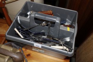 A tray of stainless steel cutlery