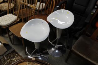 A pair of laminate and chrome kitchen high stools