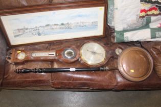 A copper warming pan and an antique mahogany barom