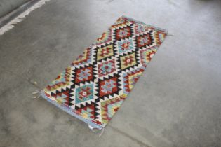 An approx. 4'9" x 2' Chobi Kelim rug