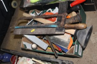 A box containing various tools to include hand saw