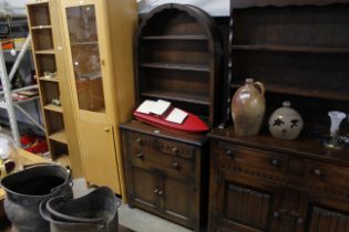 An oak dresser with arched top