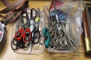 A collection of various sized scissors
