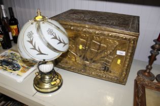 A brass embossed coal box and a table lamp with gl