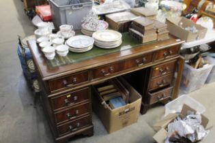 A reproduction mahogany twin pedestal writing desk