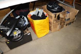 Three boxes and a bag of various computer steering