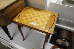 An inlaid musical occasional table with games boar