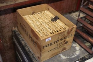 A wooden crate for 'Porto Souza' and a small wicke