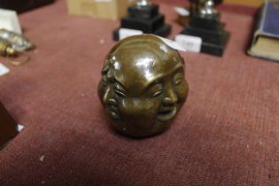 A brass four sided Buddha head