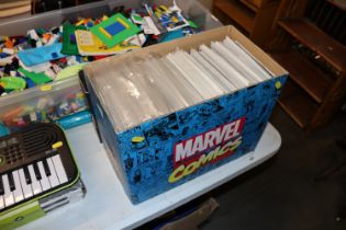 A box of Marvel comics some with signatures