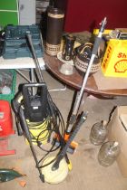 A Karcher K2 electric pressure washer with various