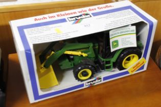 A John Deere 6400 tractor in box