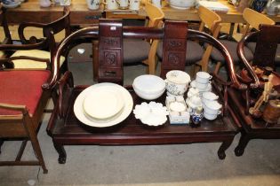 A Chinese hardwood three piece suite comprising of