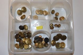 A collection of brass buttons mainly military related