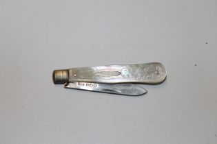 A silver bladed and mother of pearl fruit knife, hallmark Sheffield 1915