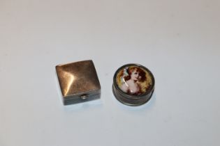 A silver pill box of square form and a circular pill box with transfer printed image of young female
