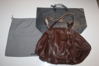 A Miu Miu large brown leather handbag with brass b
