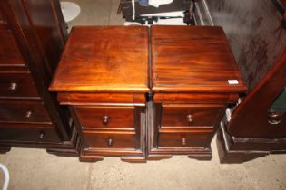 A pair of mahogany three drawer bedside units