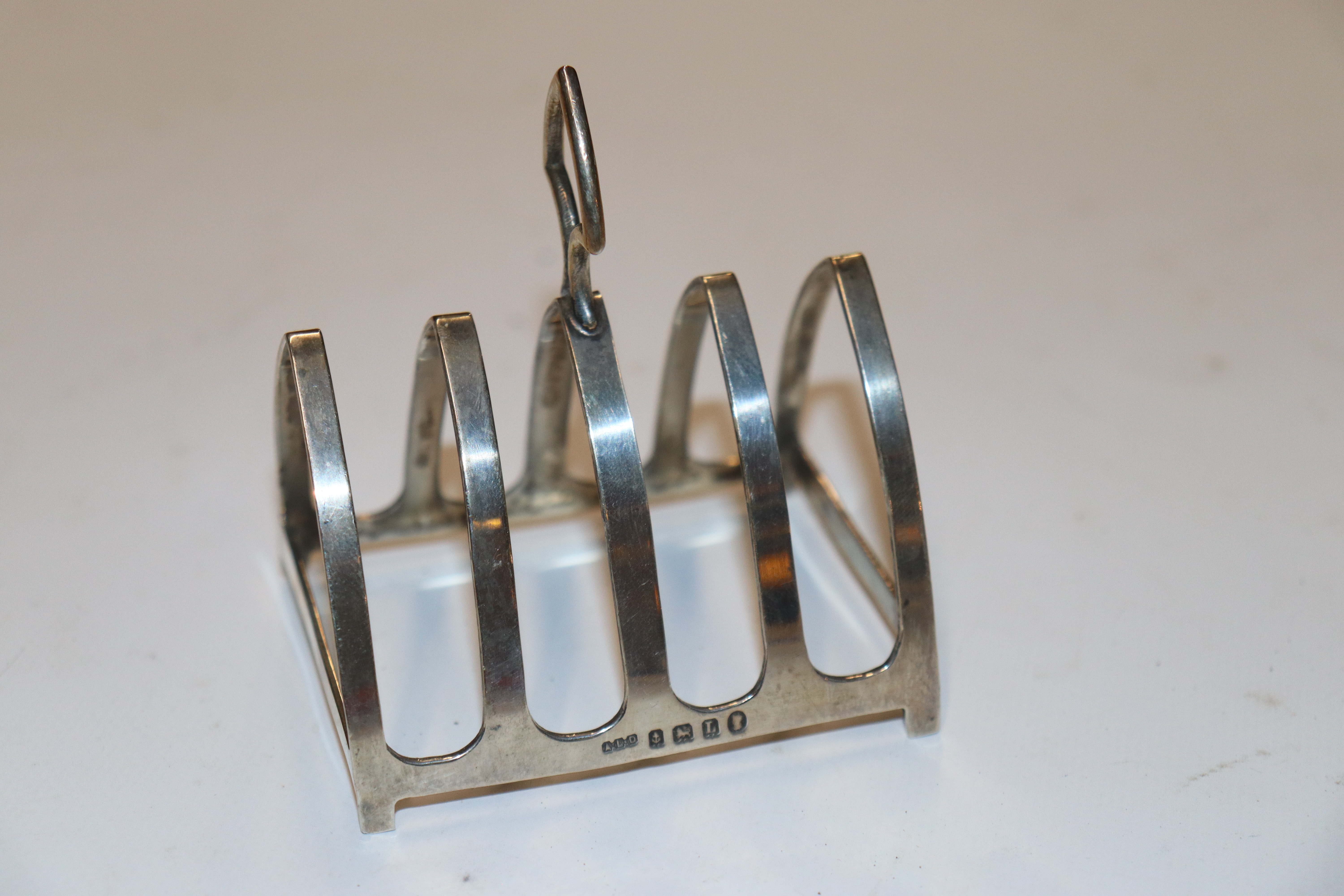 A silver four slice toast rack, hallmark Birmingham 1935 maker A L Davenport Ltd approx. 40gms