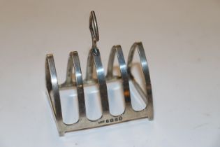 A silver four slice toast rack, hallmark Birmingham 1935 maker A L Davenport Ltd approx. 40gms