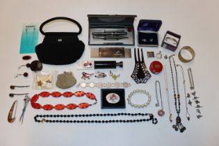 A box containing evening bag, various jewellery in