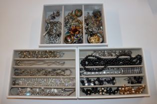 Three trays with modern jewellery including silver