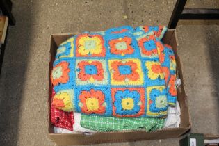 A box containing crochet and other blankets