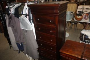 A tall mahogany lingerie chest