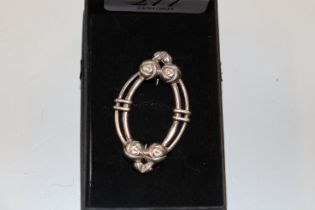 A hallmarked sterling silver Mackintosh style brooch approx. 8.5gms