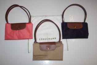 Three Longchamp related leather and vinyl handbags