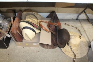 A box containing various hats to include a Dunn co