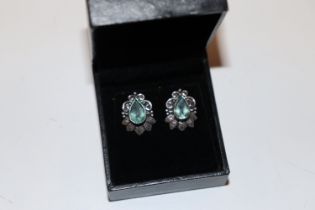 A pair of 925 silver earrings set with blue stones