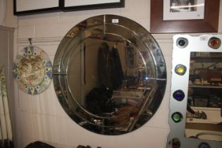 A large circular wall mirror